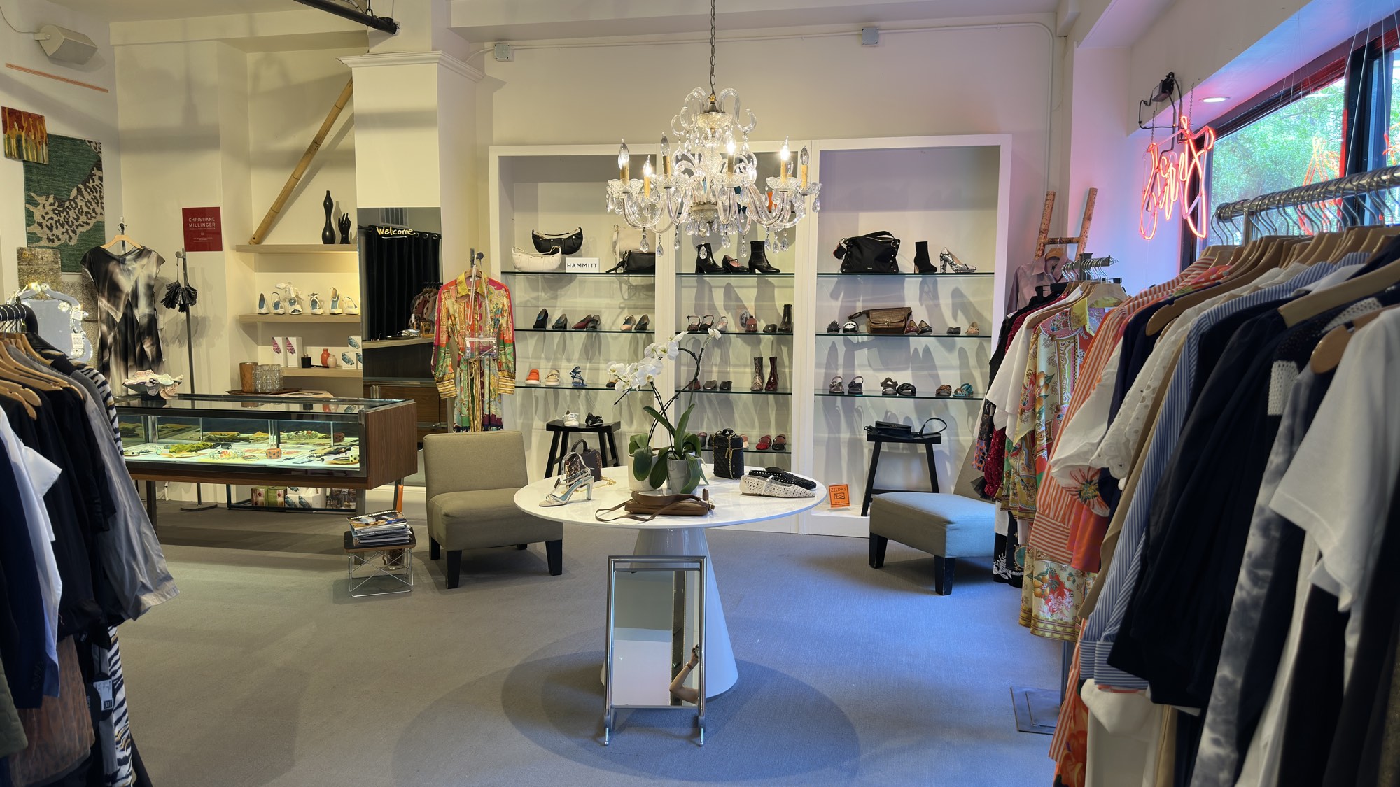The shop floor at Zelda's, shelves and racks beneath the chandelier