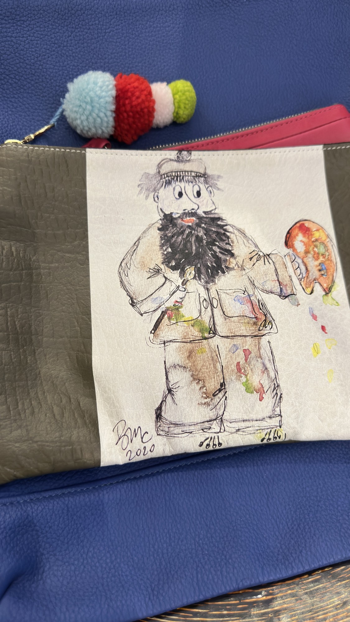 A hand-painted leather clutch on the counter at Zelda's